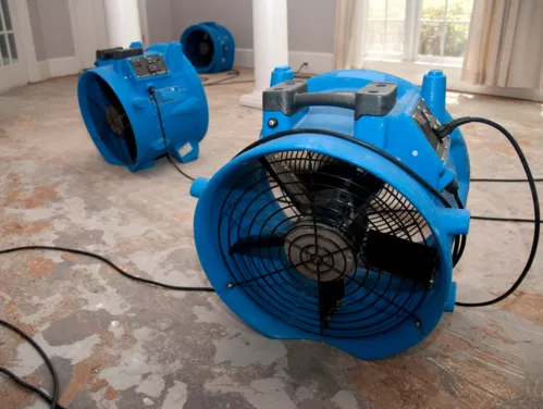 Fans drying out flooded houses.