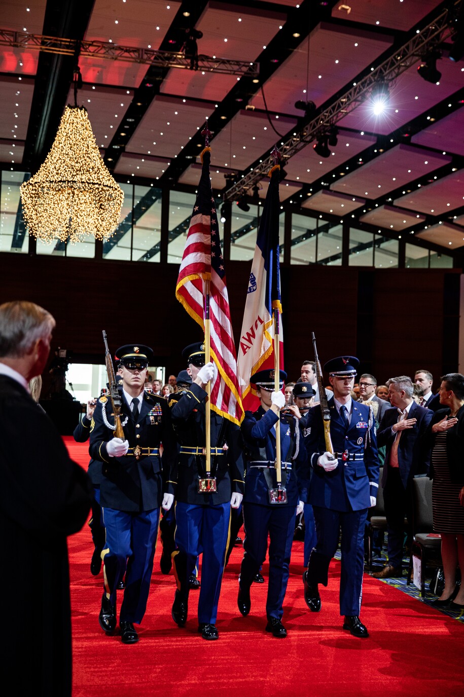 IANG Color Guard carrying flags in ceremony