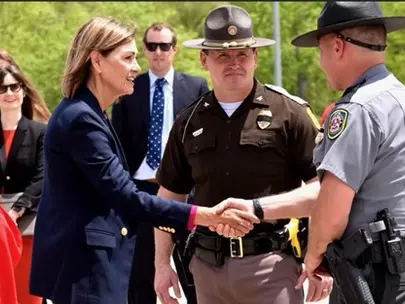 Governor Reynolds shakes Troopers hand
